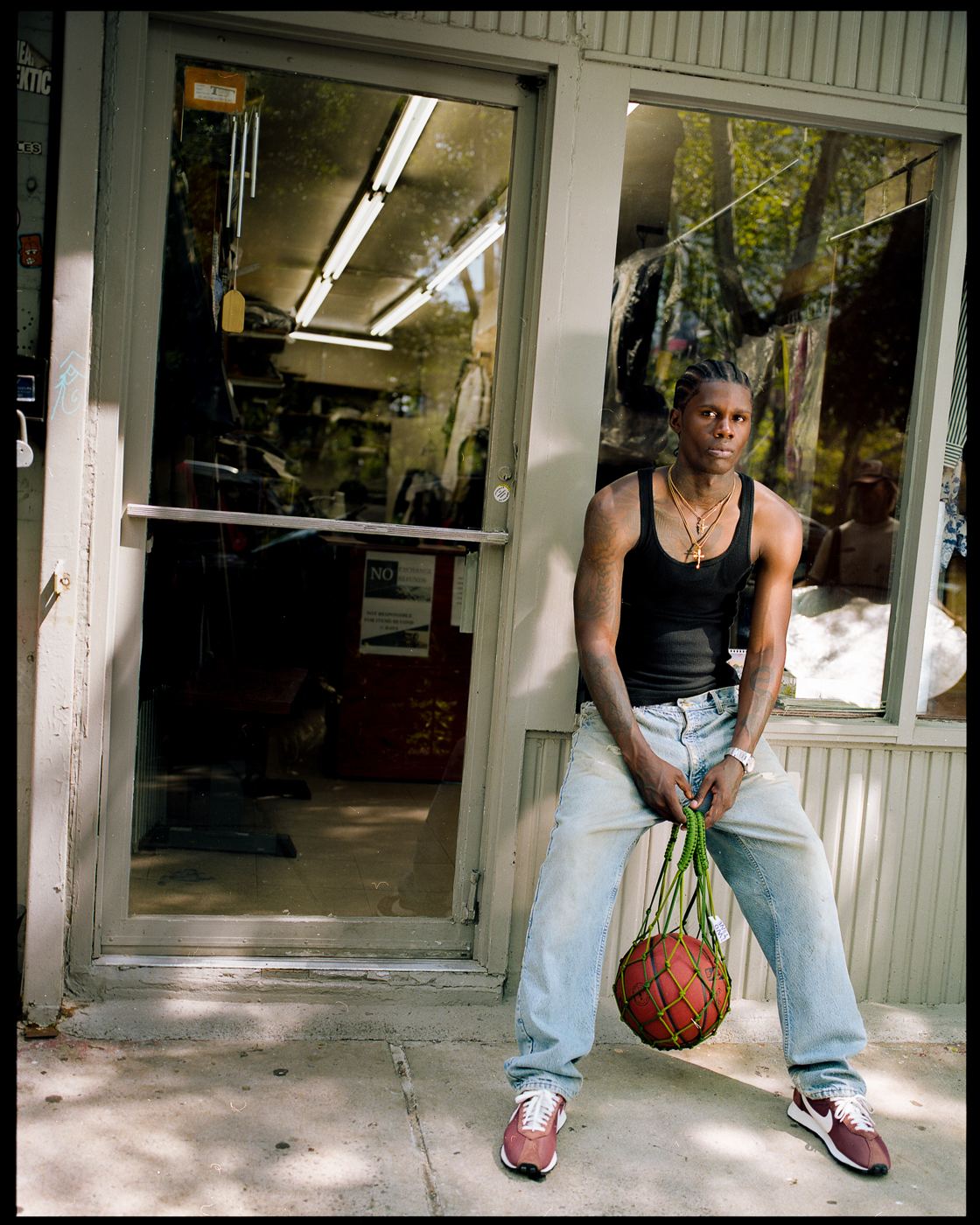 Leaning in a shop doorway