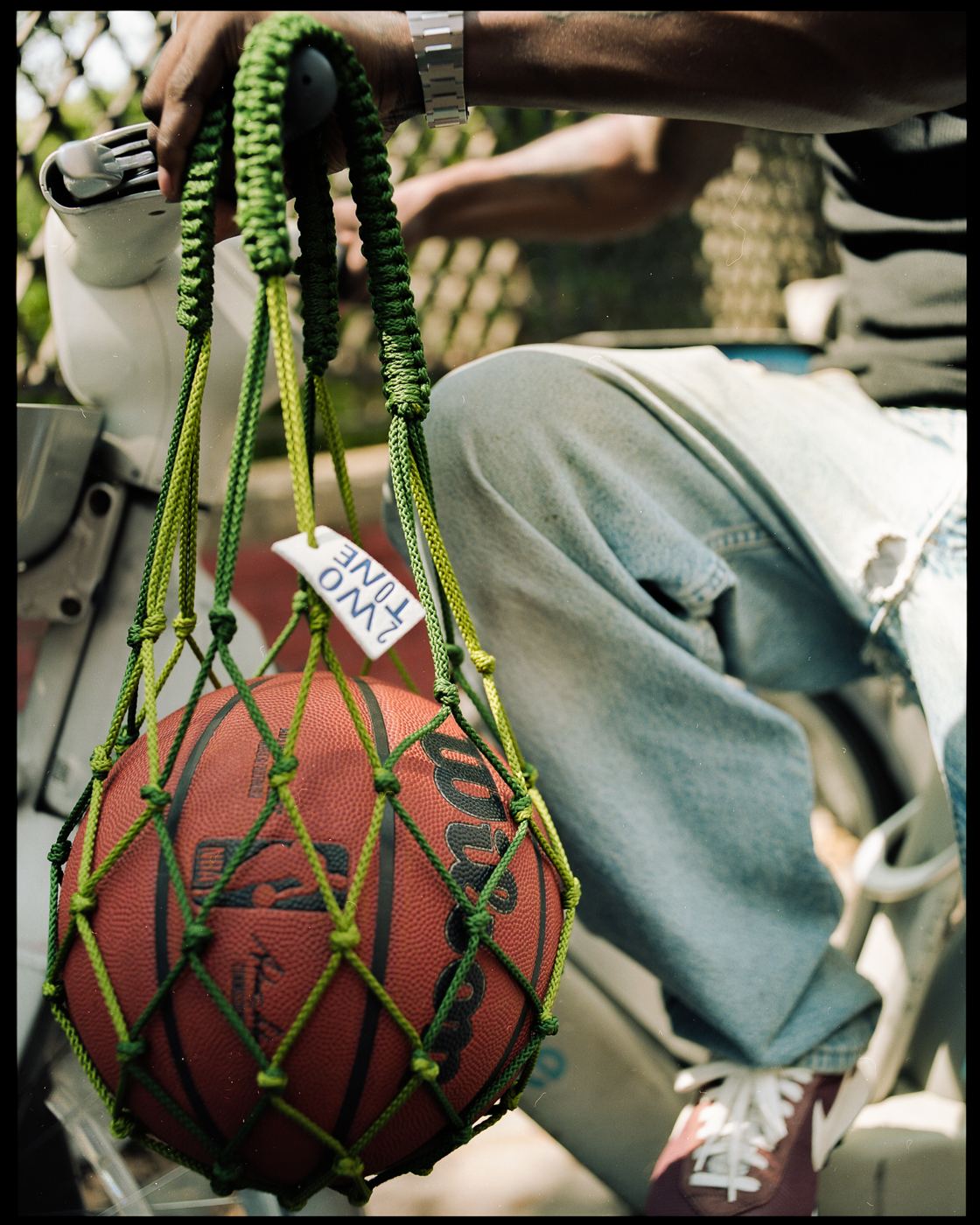 Bag detail, woven net and tag
