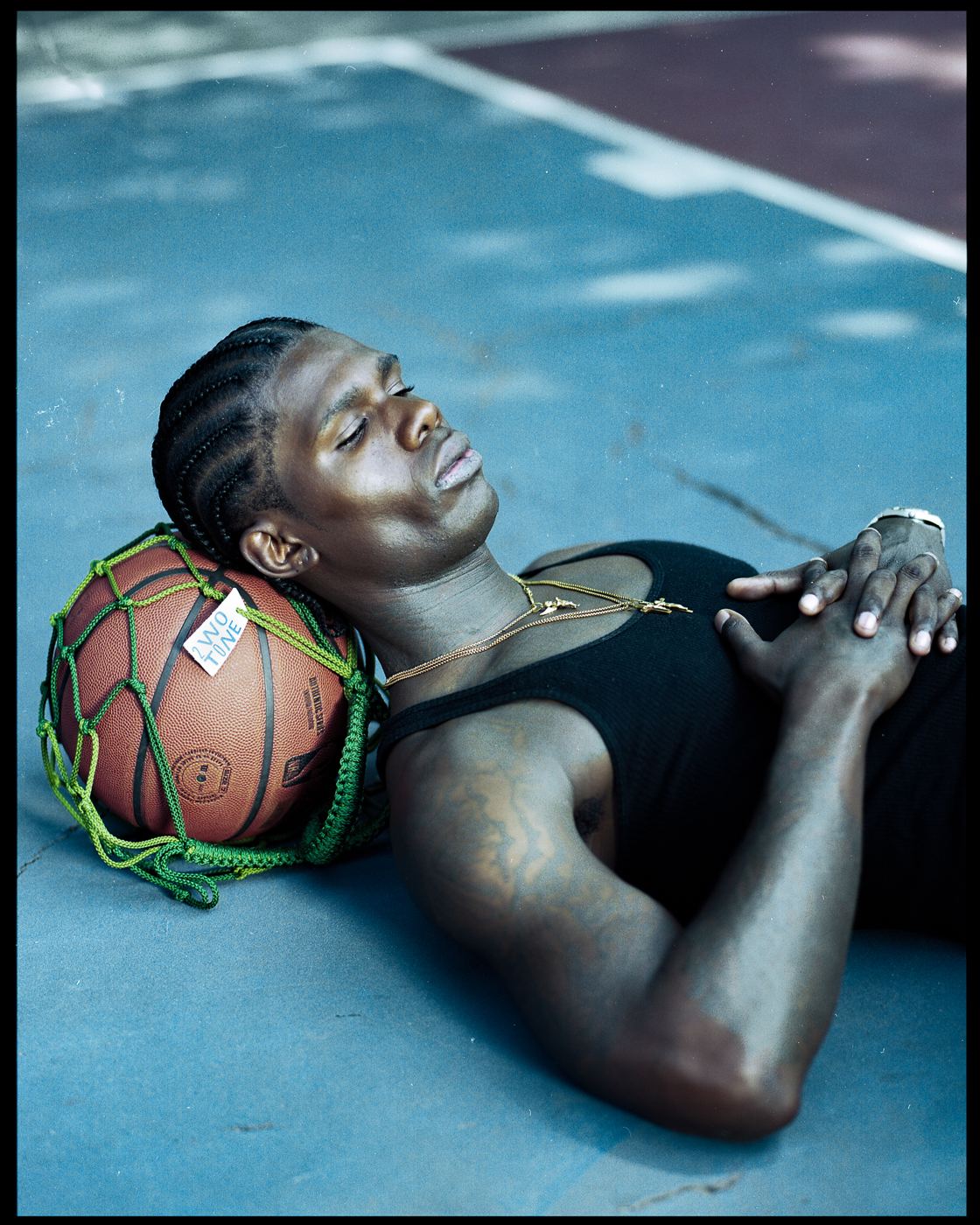 Lying on the court with the bag