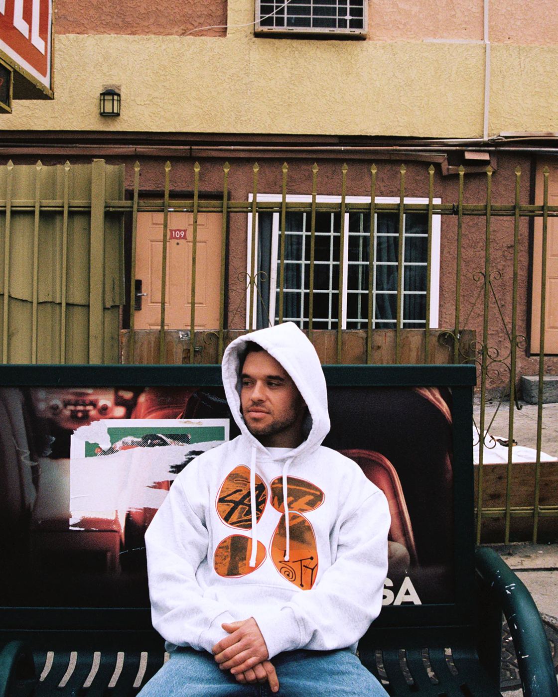 Grey hoodie worn on a street bench